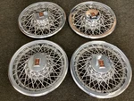 Set Of 4 Oldsmobile 15 Wire Chrome Hub Caps. Fixed Price $300.00.