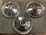 Three 1965 Oldsmobile Cutlass F85 14" Hubcaps. Fixed Price $25.00.
