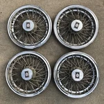 Oldsmobile Cutlass Supreme 14" Wire Spoke Hubcaps. Fixed Price $98.00.