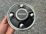 Mazda Glc Oem Wheel Center Cap Dark Gray & Chrome 1980 8532 37 191. Fixed Price $19.95.