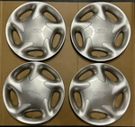 Set Of Nos Oem 1993-1997 Ford Probe 14" Directional R/l Hubcaps Wheel Covers. Fixed Price $100.00.