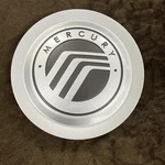 2004-2008 Mercury Grand Marquis Oem Wheel Center Hubcap Silver 5W33-1A096-AA. Fixed Price $80.00.
