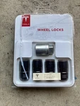 Tesla Stock Wheel Locks Set Black 1023981-01-A. Fixed Price $129.00.