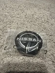 Genuine Nissan Center Cap 40342-6RA1A. Fixed Price $28.00.