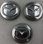 Mazda Rim Wheel Center Cap Set Silver Oem B01B34064. Fixed Price $22.49.