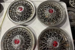 Set Of 4 Vintage Pontiac 16 Wire Wheel Hubcaps Red Arrowhead. Fixed Price $115.00.