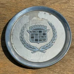 Cadillac Deville Center Cap, White, 1987-1993 Part Number 30553 04. Fixed Price $19.95.