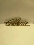 Ford 1960 Gold Galaxie Fender Emblem + Trunk Lock Bezel C0AB-16098-G. Fixed Price $34.50.