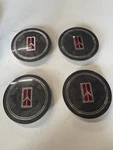 Set 1984-1988 Oldsmobile Sport 62MM Wire Wheel Center Cap. Fixed Price $25.00.