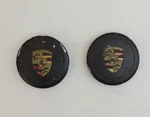 Pair Genuine Used Porsche 3-PRONG Wheel Cap 66MM Matte Black With Colored Crest. Fixed Price $135.00.