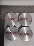 (4) Genuine Wheel Center Caps Brushed Red Gmc Set 9595010 Oem. Fixed Price $29.99.