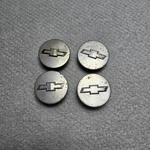 Chevrolet Wheel Center Caps 4PK Silver Gunmetal Grey 96682160 Oem Used. Fixed Price $80.00.