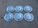 Wheel Covers Group Of 6 1957 Dodge Coronet Lancer Royal Knights Head Hubcaps 14". Fixed Price $69.90.