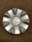 2009-2014 Hyundai Genesis Center Cap Oem #52960-3M250 Repainted Silver Od. Fixed Price $25.00.