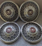 Full Set 80S Cadillac Locking 14 Inch Wire Spoke Hubcap. Fixed Price $195.00.
