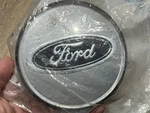 New Oem Ford F8AZ-1141-AA Emblem Hubcap Unopened. Fixed Price $109.00.