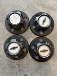 Set Of (4) 1985-95 Chevy Astro Oem Center Hub Cap 1447 15594372 15594373 Black. Fixed Price $50.00.